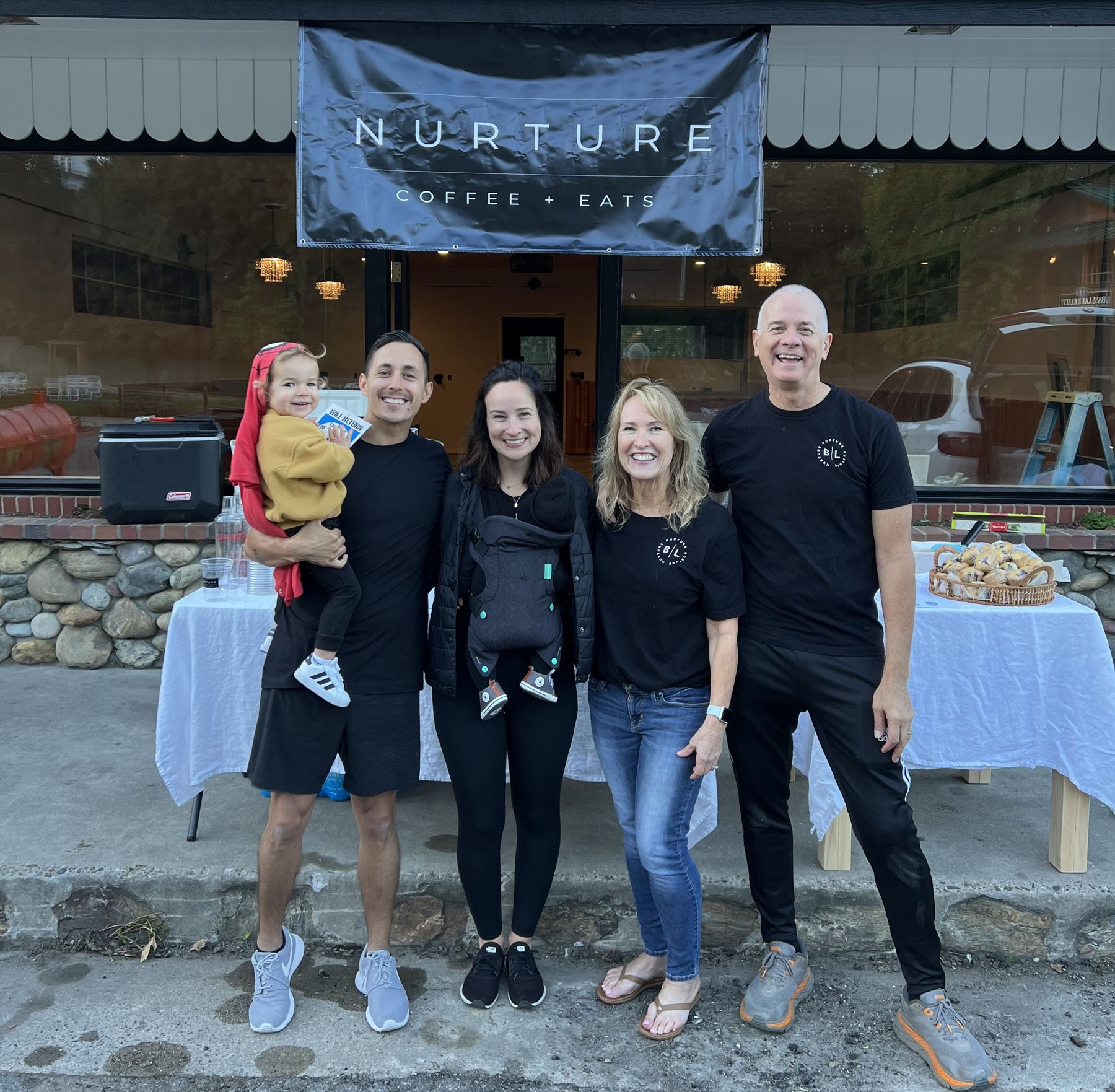 Nurture family in front of the shop on opening day